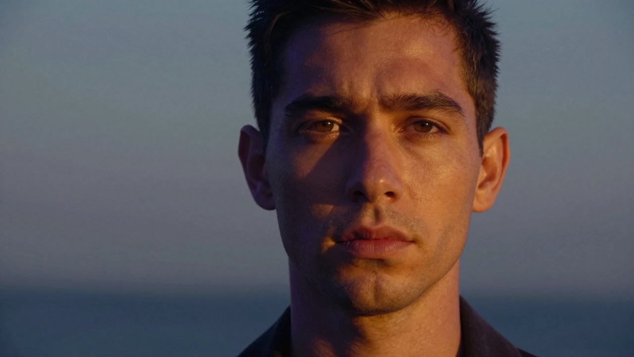 Portrait with warm skin popping against a muted cool blue background under golden light.
